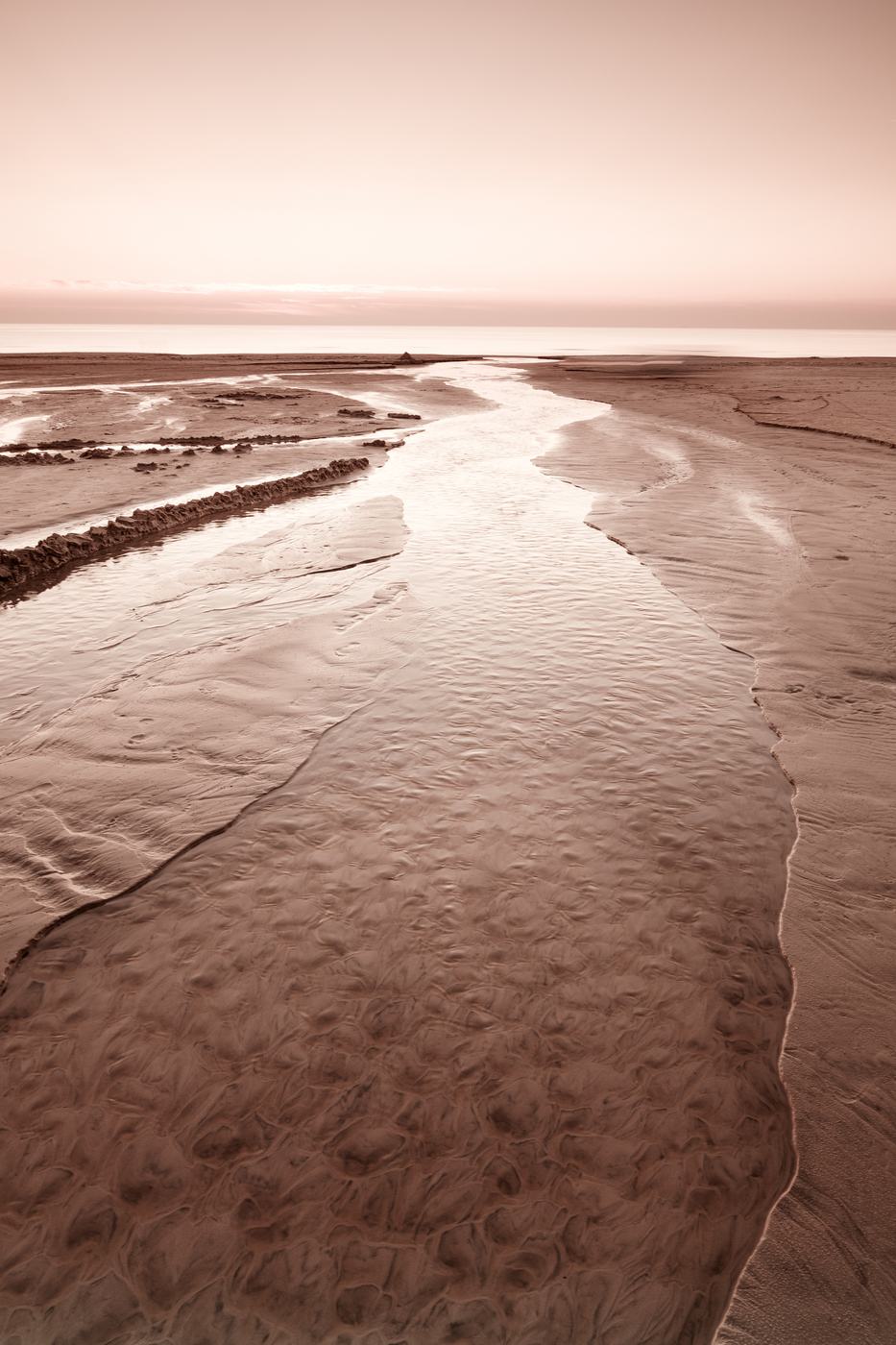 Calm morning light over an empty shoreline